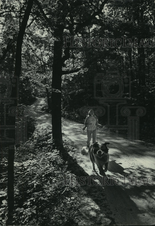 1976 Jane Holbrook enjoys an early morning jog near North Lake - Historic Images