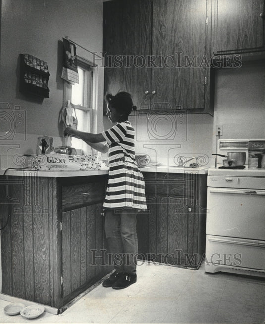 1972 Mrs. Rubie McLemore's Daughter In Their Kitchen In Milwaukee-Historic Images