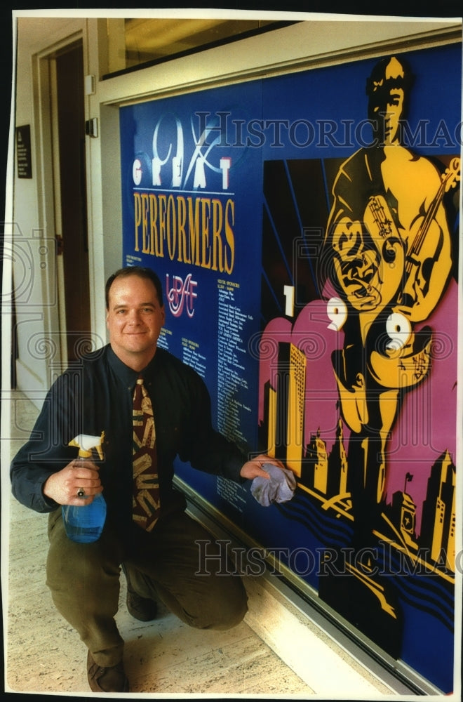 1994 Jim Pitroski of Thiel Visual Design touches up a display-Historic Images
