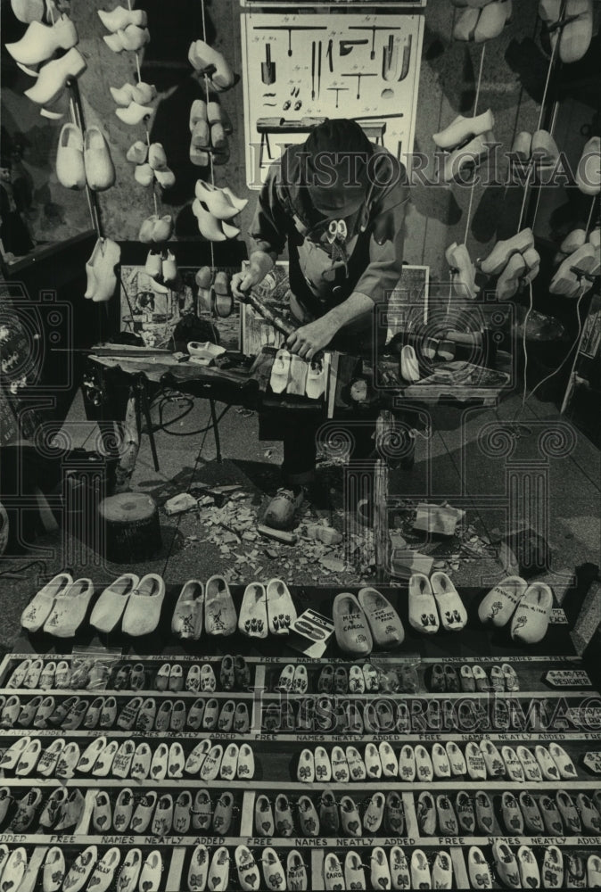 Press Photo Bob Siegel, Junior working on shoes, others on display, Wisconsin - Historic Images