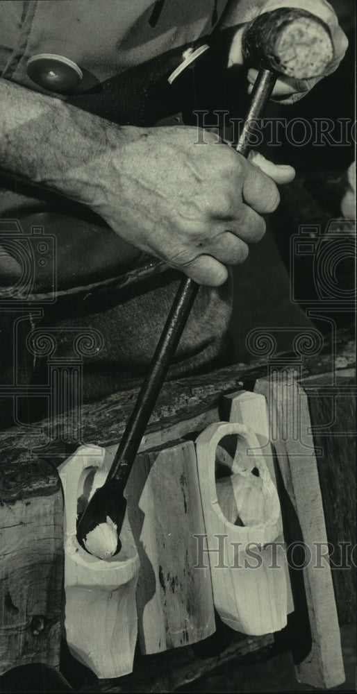 1983 Bob Siegel Jr carves wooden shoes at Milwaukee Public Museum - Historic Images