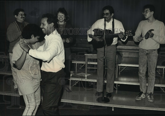 1988 Felipe Rodriguez Jr. plays guitar, Thomas Edison Middle School. - Historic Images