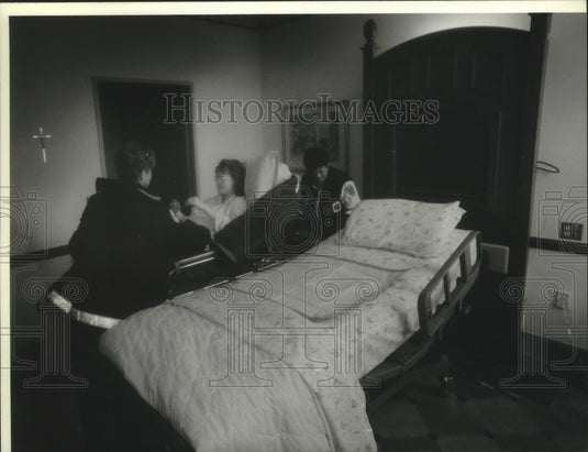 1994 Bensing assisted in new bed at new St. Mary's Hospital, Mequon - Historic Images