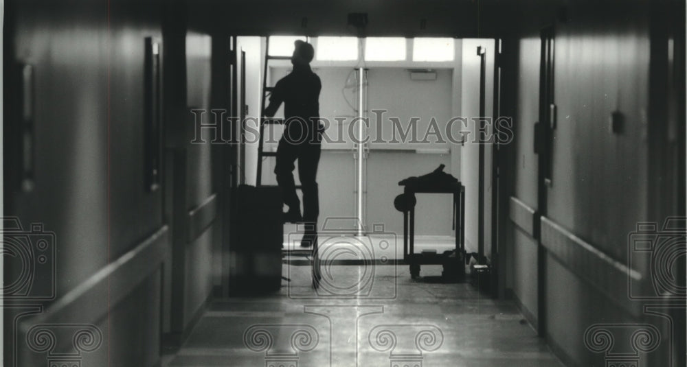 1994 Worker at new St. Mary's Hospital in Mequon finishes up details - Historic Images