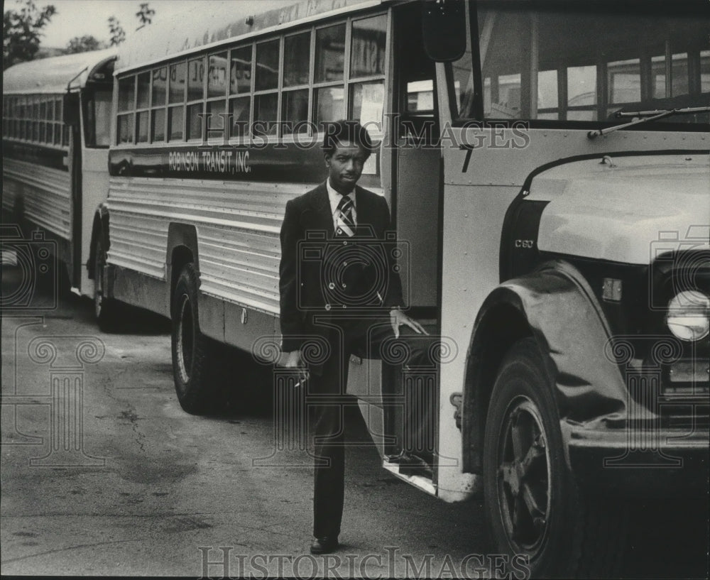 1976 Terry Robinson standing with one of the school buses he manages-Historic Images