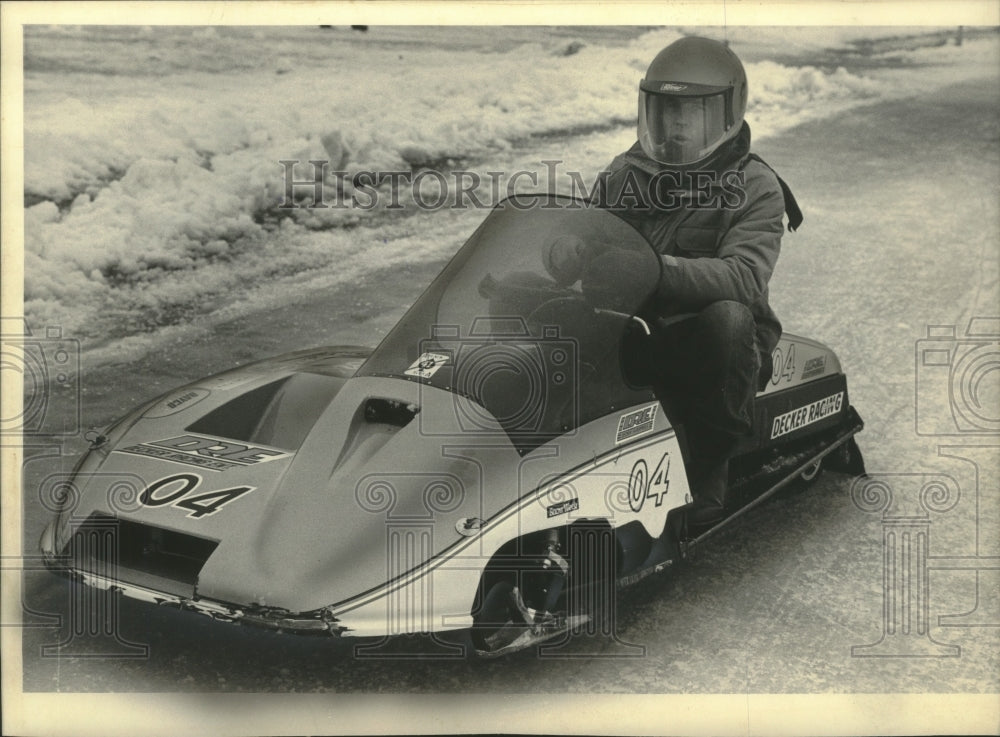 1988 Columnist Roger Salick in Formula 1 racing snowmobile - Historic Images