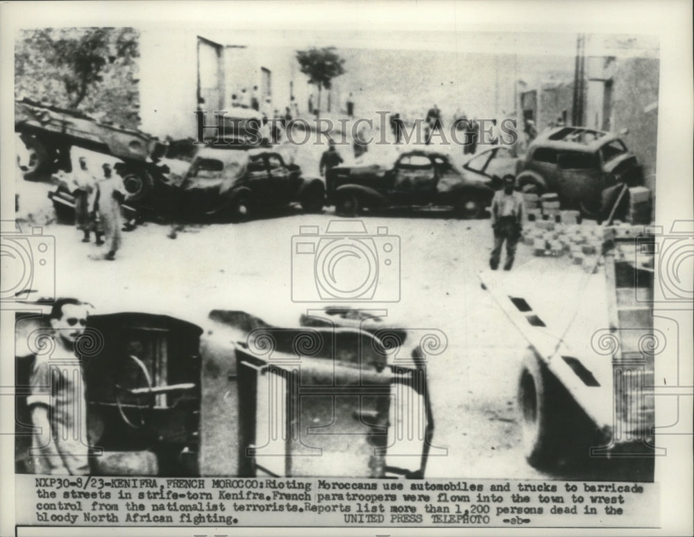 1955 Press Photo Rioting in Kenifra, Morocco, use trucks to barricade streets - Historic Images