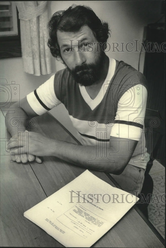 1984 Nick Salerno with Agent Orange lawsuit paperwork - Historic Images