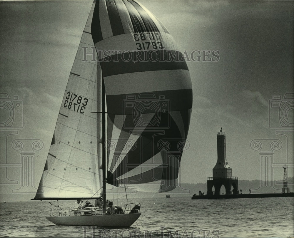 1983 Donald Stitt sailed his sloop, Magic, into Port Washington - Historic Images