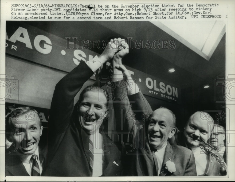 1966 Onlookers watch Wayne Olson, Robert Short hold up hands, MN. - Historic Images