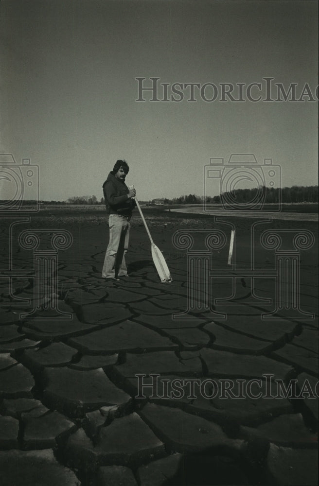 1981 Dick Rost in dry riverbed of Oconto River Wisconsin - Historic Images