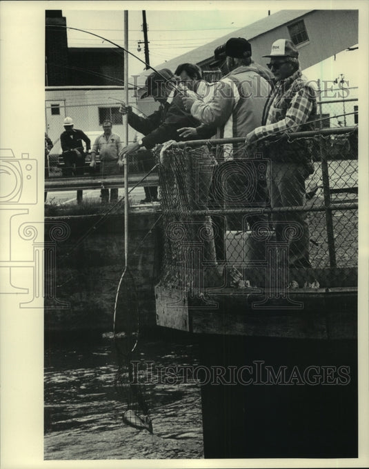 1983 Men fishing near the Wisconsin Electric Co. property-Historic Images