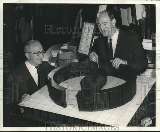 1967 Men looking at The American Stock Exchange model to be built-Historic Images