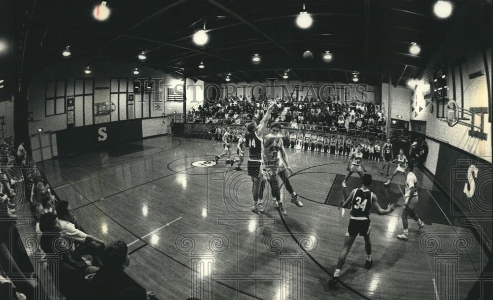 1992 Shullsburg, WI High School basketball team plays in gym - Historic Images