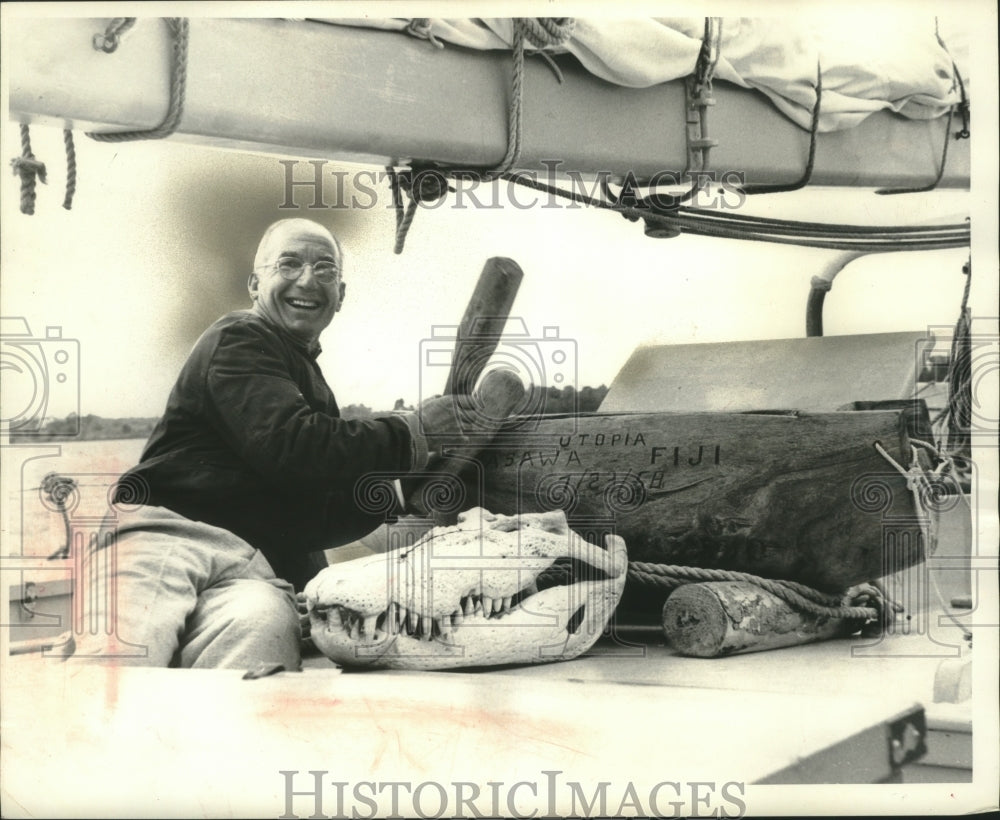 1959 Press Photo Shipbuilder Fred Peterson aboard Utopia displays a Fijian drum- Historic Images