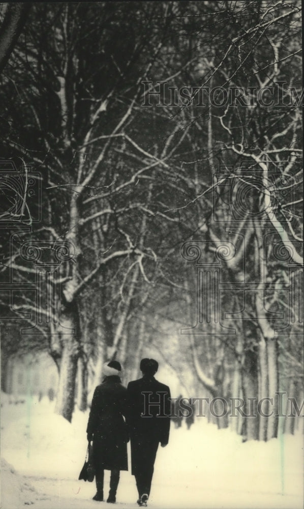 1985 A couple strolled through snow-covered Gorky Gardens, Leningrad-Historic Images