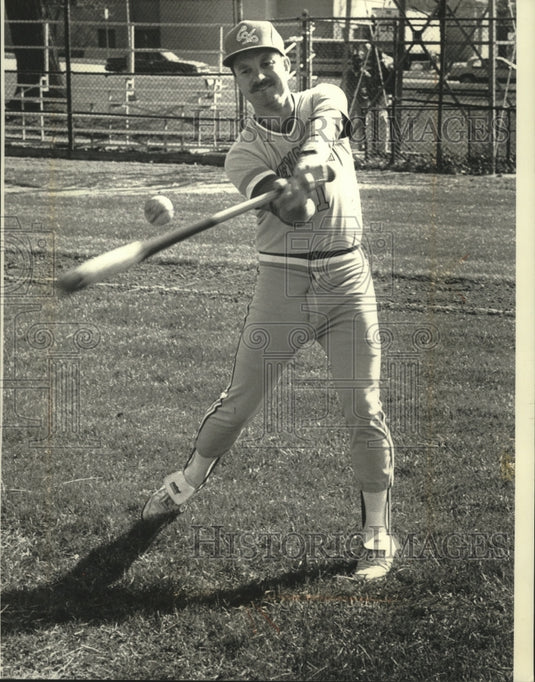 1991 Catholic Memorial Coach Dan Plechaty hits ball at practice - Historic Images
