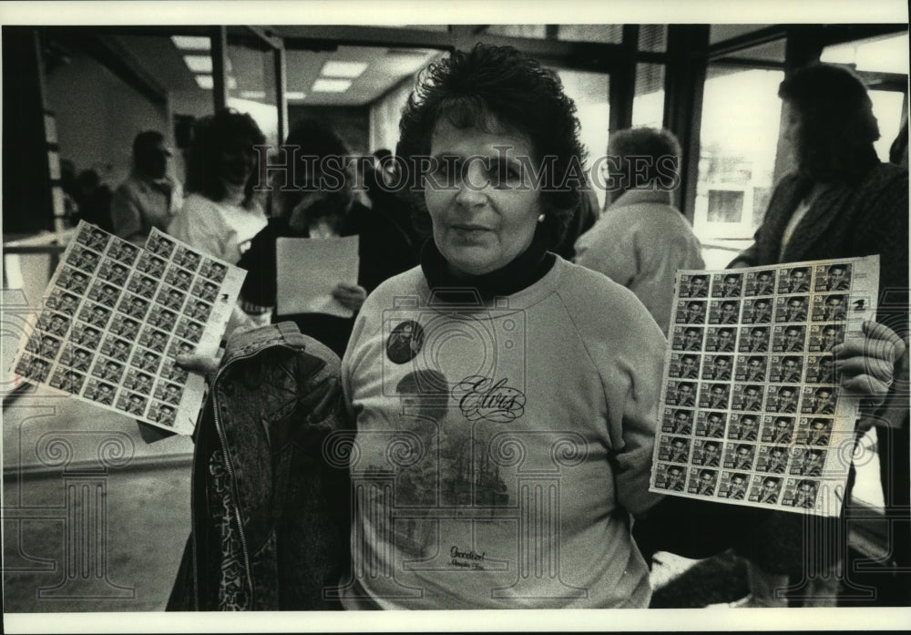 1993 Pat Thuis holds Elvis stamps, Waukesha Post Office - Historic Images