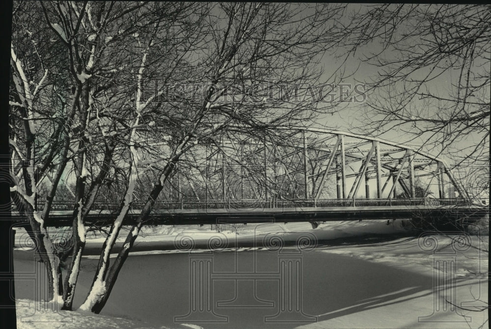 1986 Highway bridge over snowy Milwaukee River, Saukville Wisconsin-Historic Images