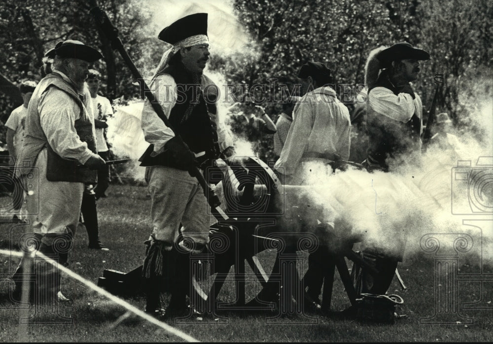 1992 Crossroads Rendezvous period dressed men fire cannon, Saukville-Historic Images