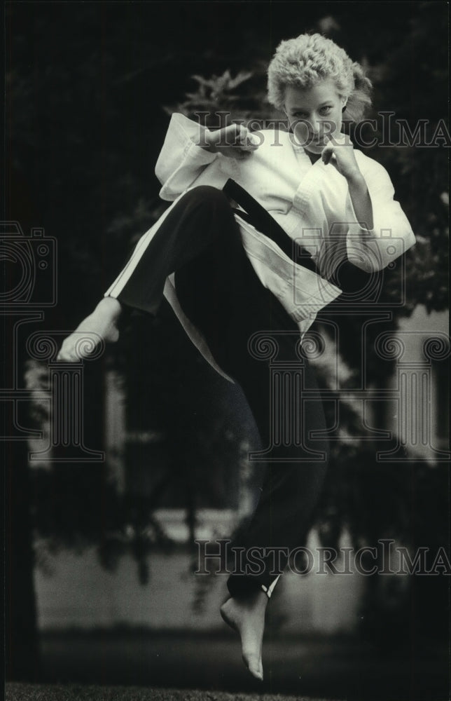 1983 Tracey Stanger practices Tae Kwon Do for exercise and safety - Historic Images