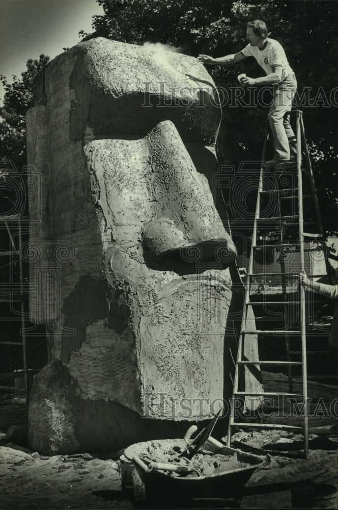 1980 Joe Stanke's 14-foot Easter Island stone sculpture, Milwaukee-Historic Images