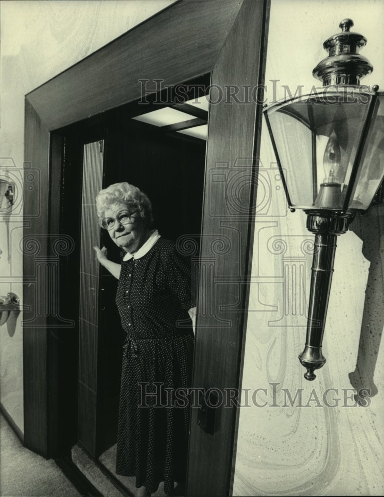 1983 Arlene Schmid works as an elevator operator in Milwaukee - Historic Images