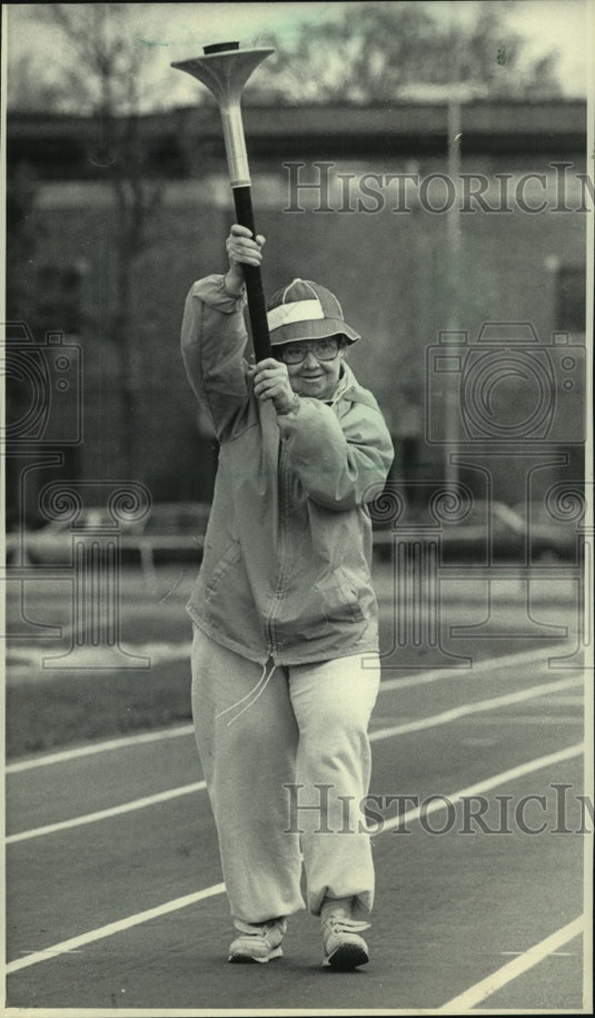 1985 Press Photo Barb Roesser holds Olympic Torch, Special Olympics - mjb93862-Historic Images
