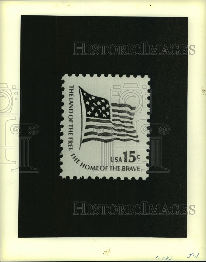 1981 A 15-cent U.S. postage stamp with waving flag-Historic Images