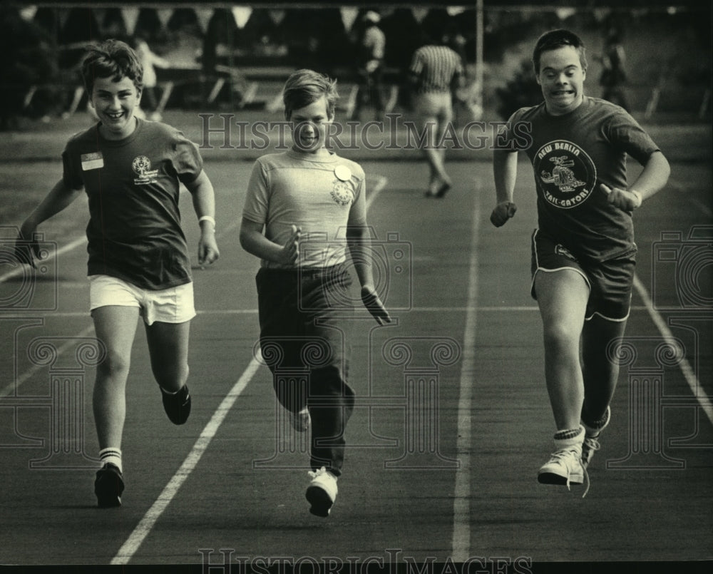 1987 Trio of boys in Wisconsin Special Olympics at Stevens Point. - Historic Images
