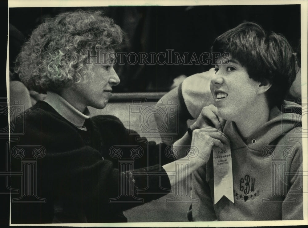 1985 Polly Beal put ribbon on her daughter, Cecily, Special Olympics-Historic Images