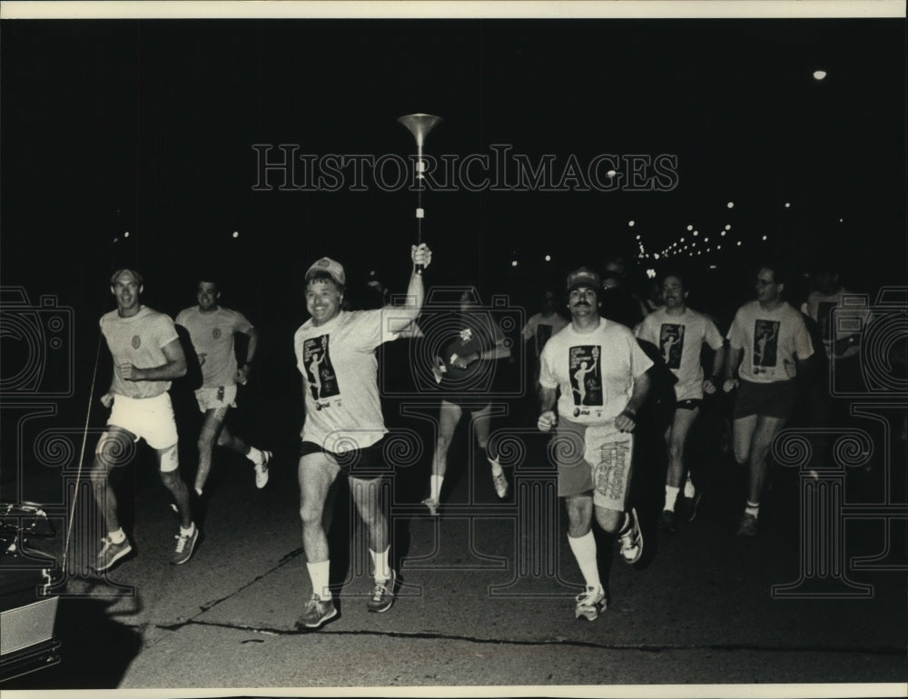 1989 Milwaukee area law enforcement in torch run, Special Olympics - Historic Images