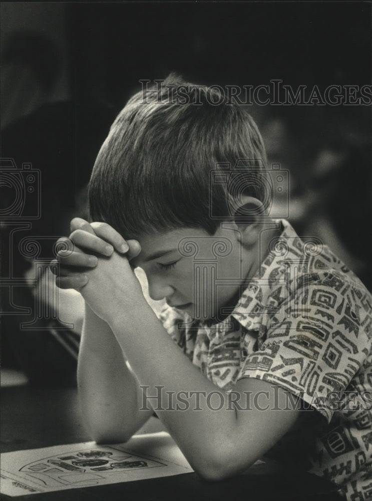 1991 Ozaukee Christian School Adam Berres says prayer before snack - Historic Images