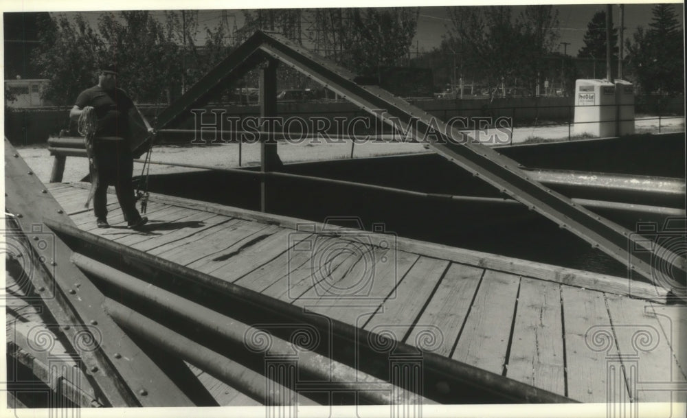 1994 Press Photo Damian Bertling Crosses Sauk Creek in Port Washington - Historic Images