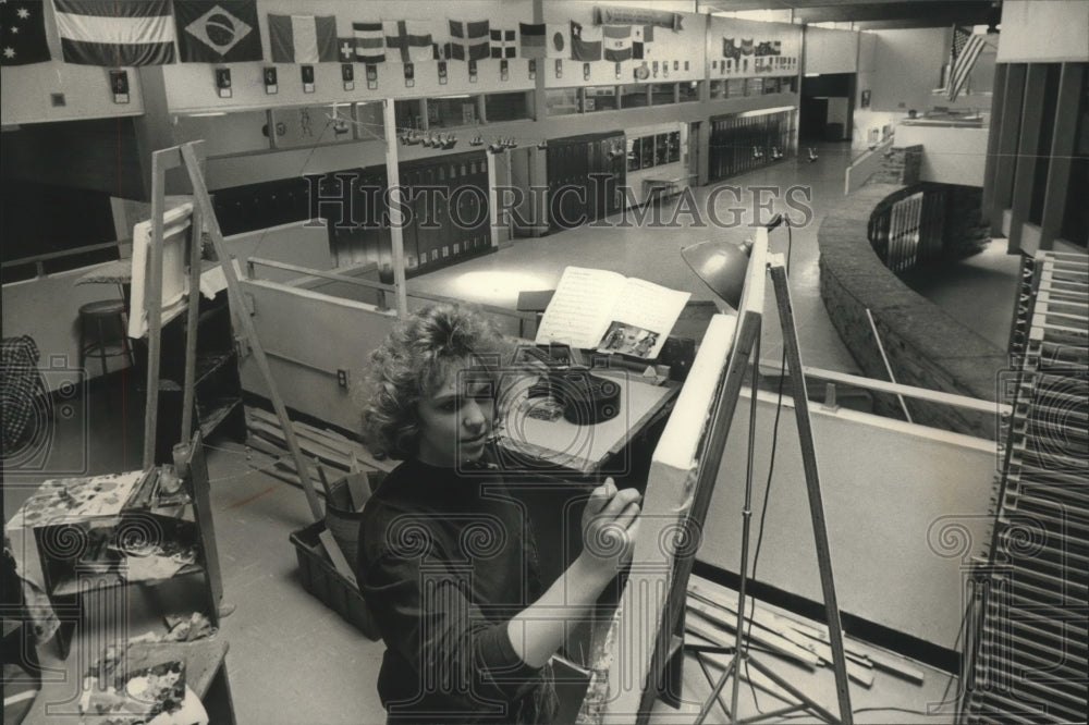 1989 Anne Schopen works in art class overlooking main area of school - Historic Images