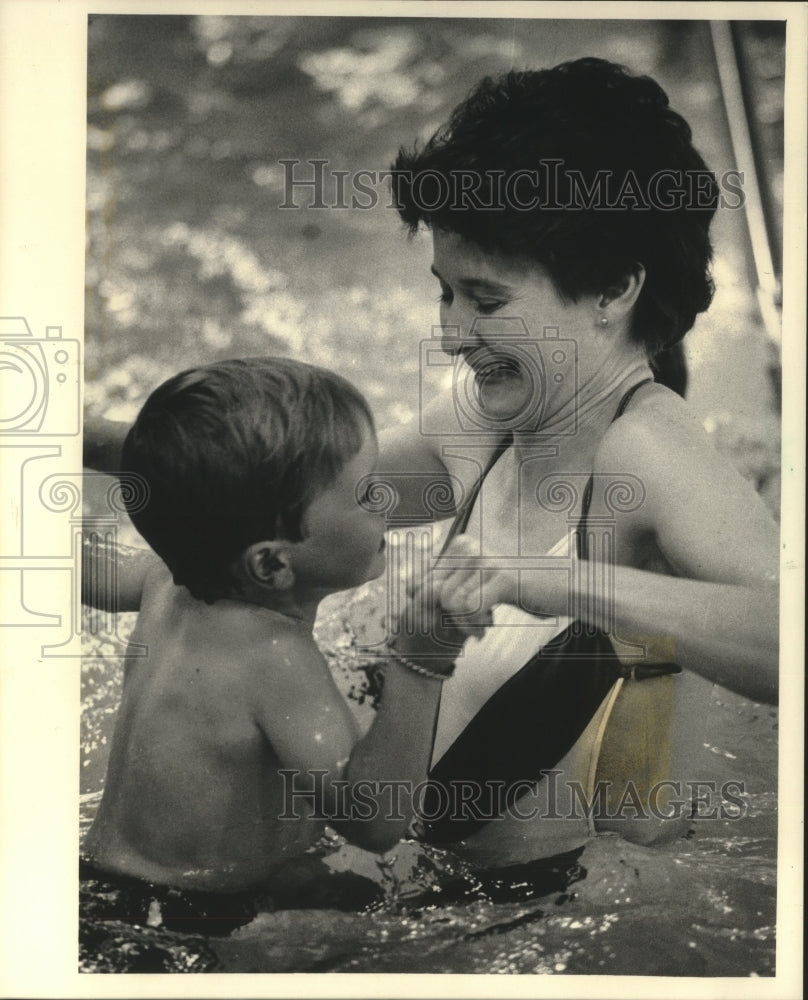 1985 Nora Matthews plays with son at Port Washington Aquatic Center.-Historic Images
