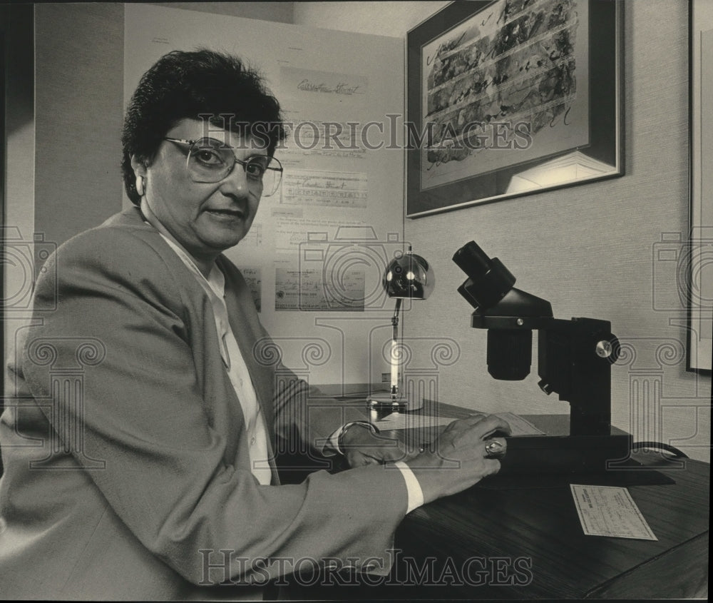 1987 Bonnie Schwid, at microscope, Milwaukee, Anagraphics, Inc. - Historic Images