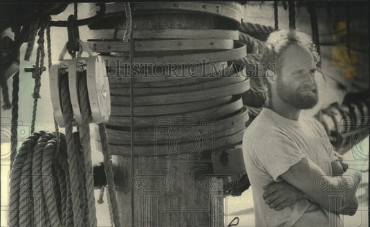 1987 Deckhand Pat Weakland answers questions about fishing boat. - Historic Images