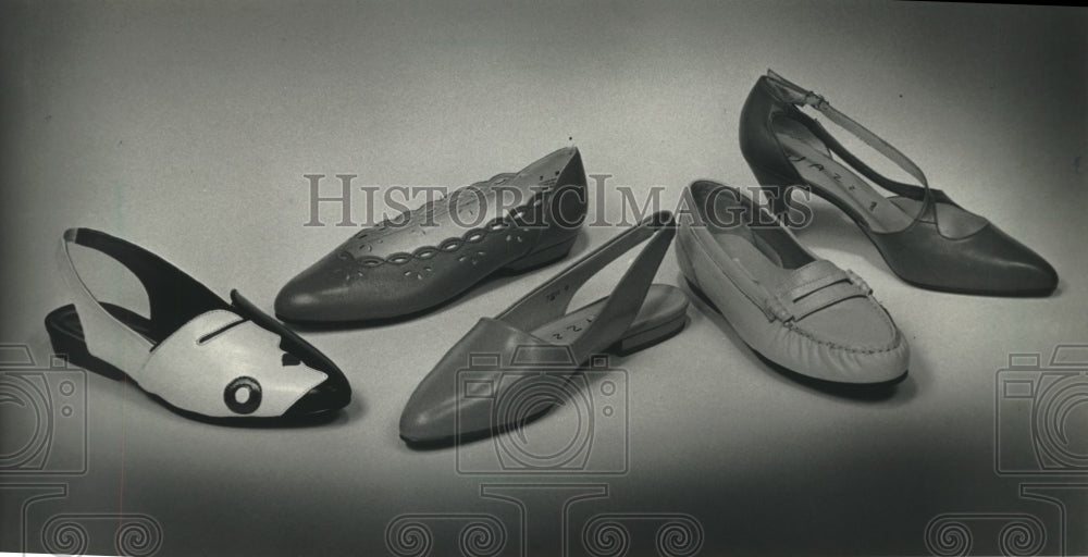 1991 Press Photo Silhouettes, cutouts and wraparound straps adorn spring shoes. - Historic Images