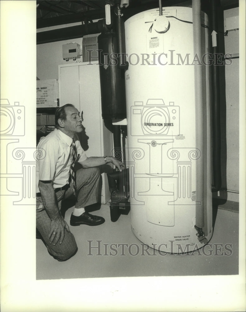 1982 Theodore Braam Examines Solar Energymaster In His Home - Historic Images