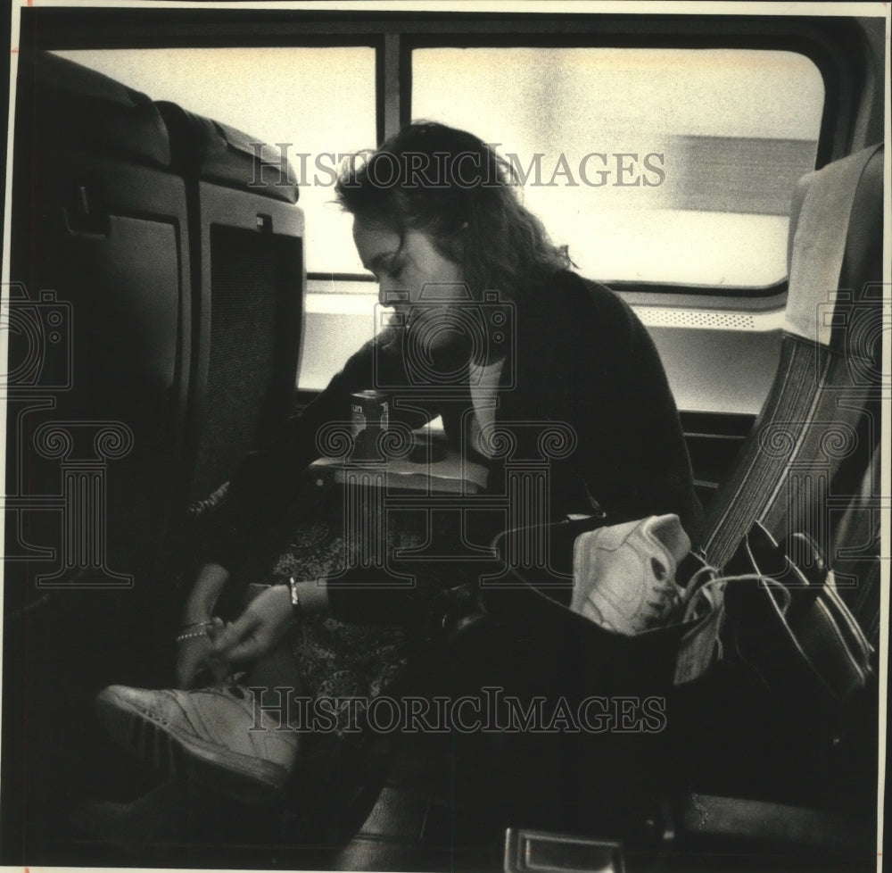 1991 Attorney Nancy Slovik on her daily commute aboard Amtrak train. - Historic Images
