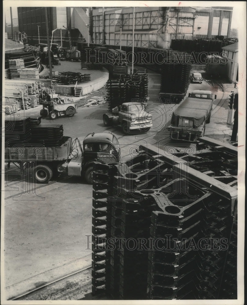 1956 Press Photo Trucks and railroad flat cars used at A. O. Smith Corp-Historic Images