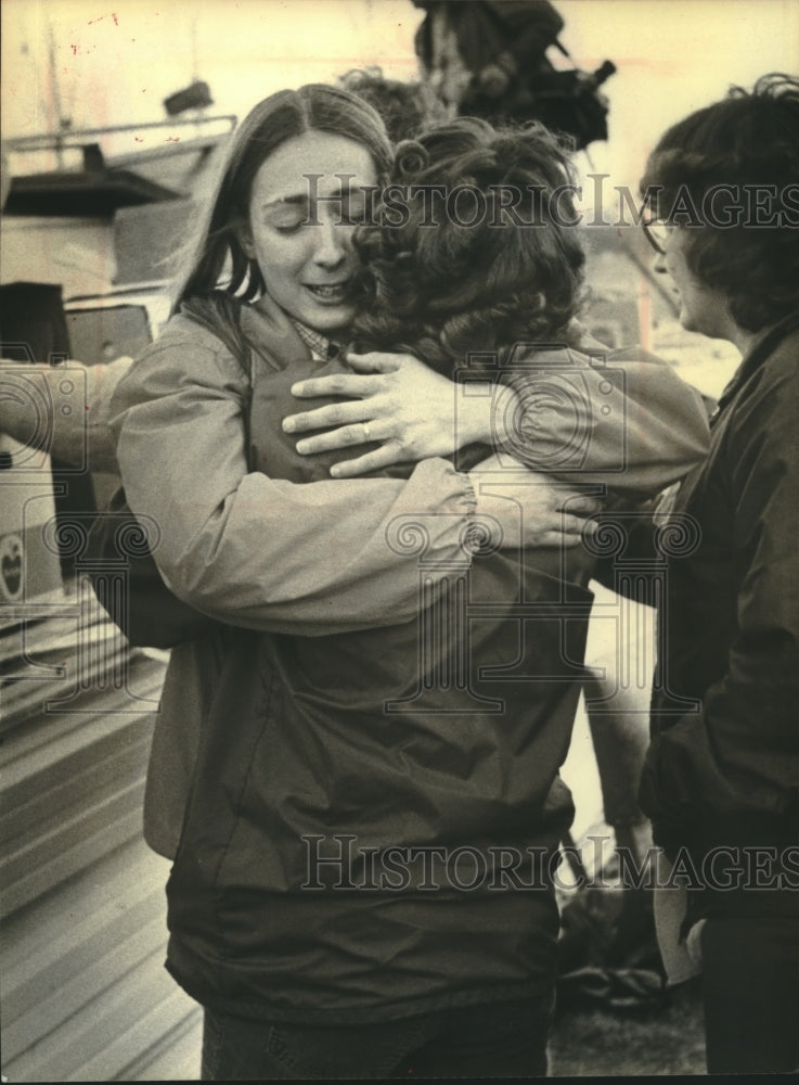 1980 Pat Hartzheim greeted by friend after Wisconsin storm - Historic Images