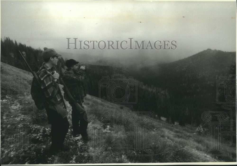 1994 Patrick Koper, Paul Paulson tracking Rocky Mt. Elk, Wisconsin. - Historic Images