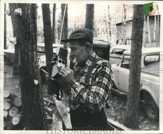 1952 Press Photo Frank Schmitt taking a call from rescue squad's radio. - Historic Images
