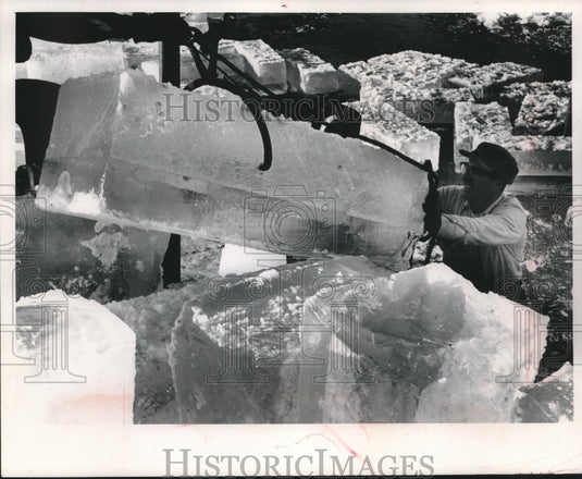1964 Press Photo A winch helps load this 400 lb. cake of ice. - mjb99591 - Historic Images
