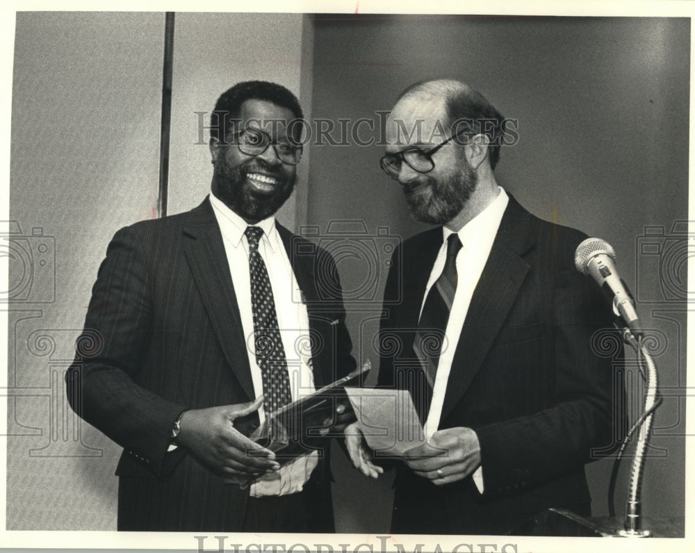 1991 Press Photo Gregory Stanford receives award from Tom Heinen - mjb99989 - Historic Images