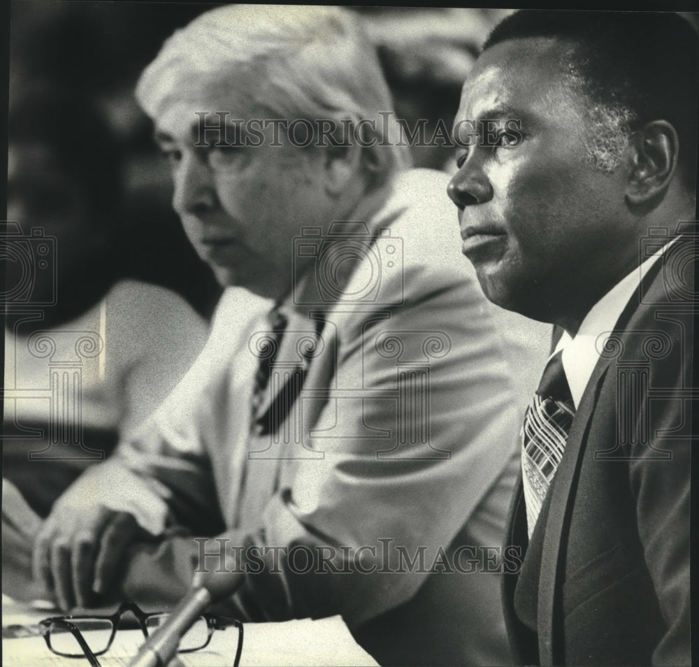 1980, Symuel Smith (right) and Milwaukee County Executive at hearing. - Historic Images