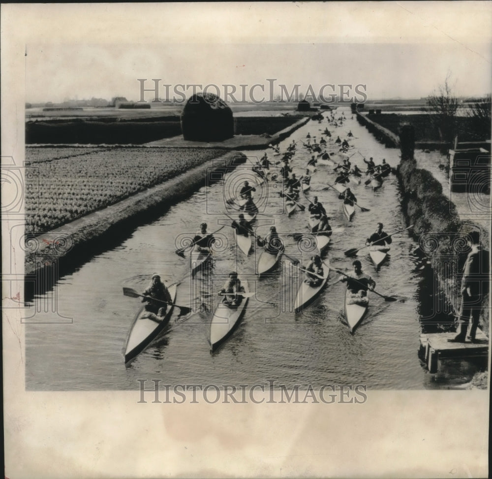 1956 Dutchmen paddling kayak type canoes near Amsterdam, Holland - Historic Images