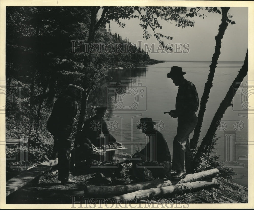 1960 Press Photo Men at campfire, Isle Royal National Park - mjc01070 - Historic Images